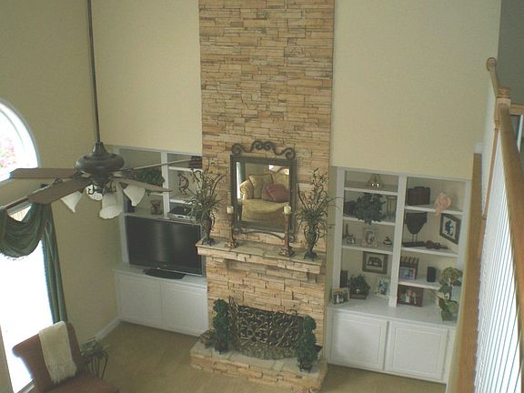 Dramatic stacked stone fireplace in family room