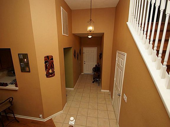 Soaring two story Entryway and Ceilings in the Dining and Living Room