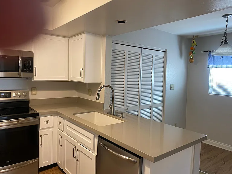 kitchen and breakfast area; laundry behind doors