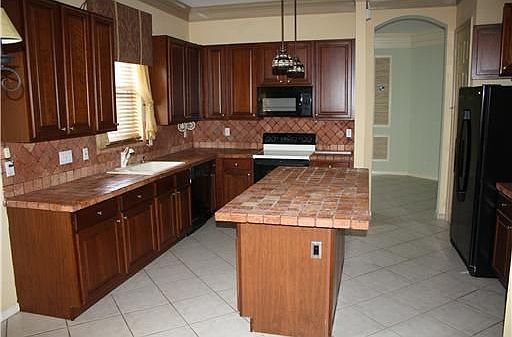 Cherry cabinets with undercounter lighting