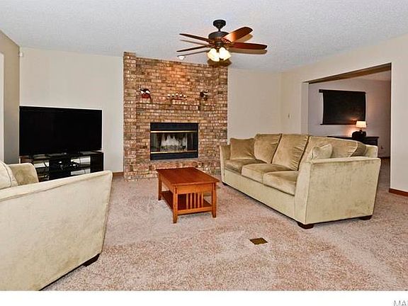 Gas fireplace with floor-to-ceiling brick