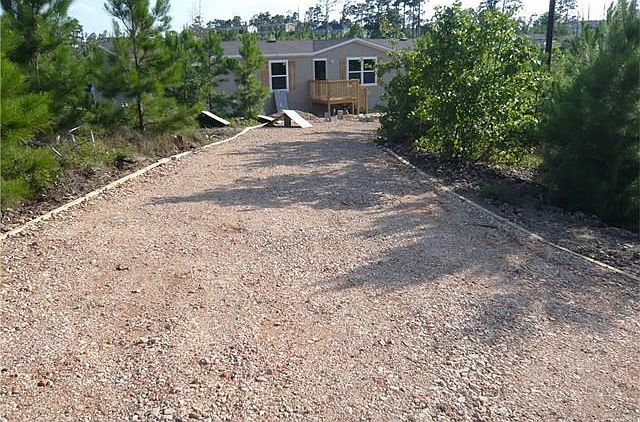 Home has been delivered finishing porches, skirting, A/C and septic. Doublewide on 0.997 acre lot in
