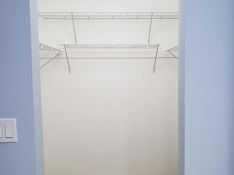 Primary Bedroom walk in closet