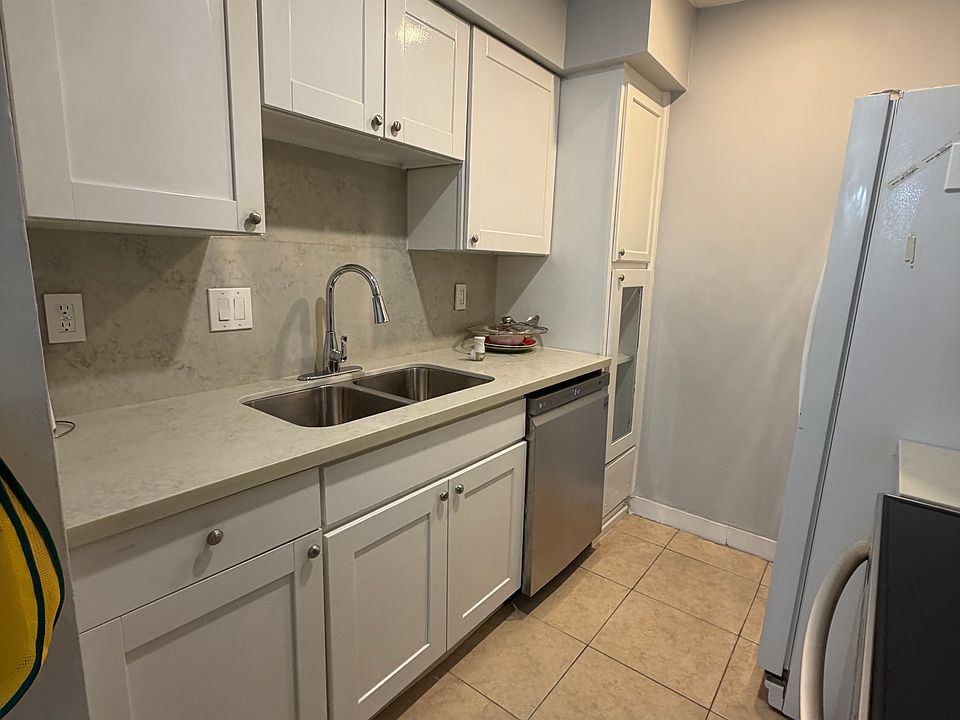 Updated kitchen with dishwasher and modern finishes.