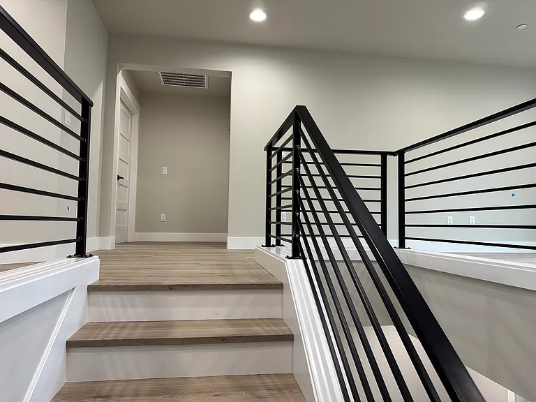 Stairs with view of upstairs