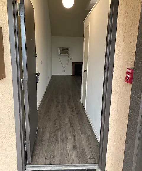 Entry from out of doors with a nice entry view. Coat closet, fireplace and hear/air conditioner. Laminate flooring throughout.
