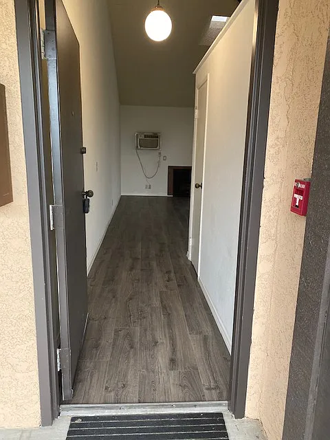 Entry from out of doors with a nice entry view. Coat closet, fireplace and hear/air conditioner. Laminate flooring throughout. - 10307 Mount Gleason Ave #301