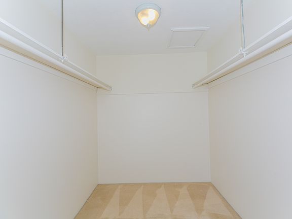 Primary bedroom walk in closet