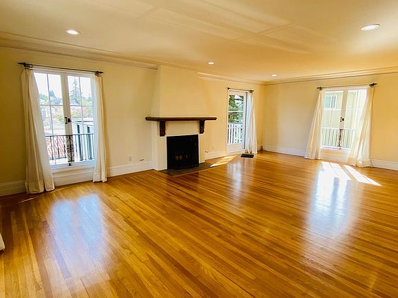 Living room with fireplace and door to deck