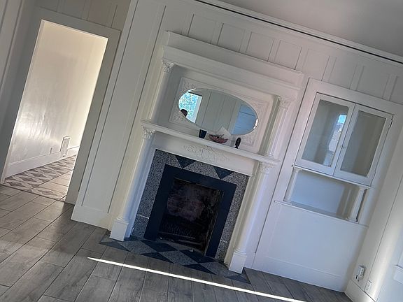 Living room with non-functioning fireplace. Just for aesthetics.