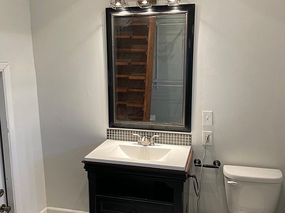 Bathroom w/exit door to washer/dryer