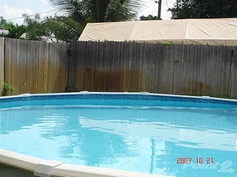 An above ground circular pool
