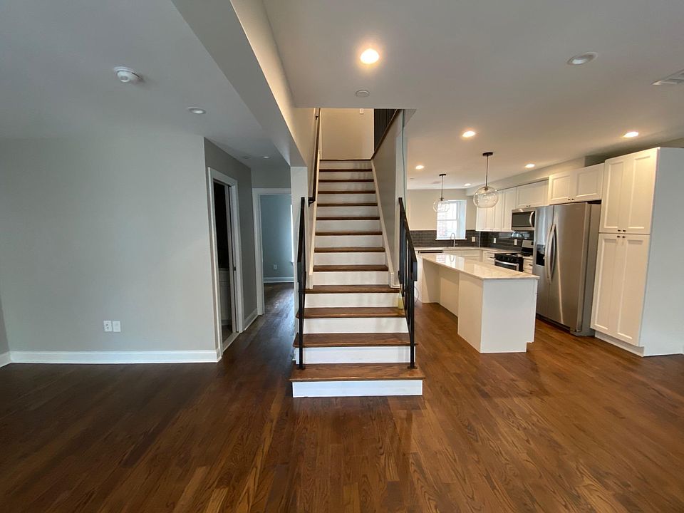 Stair to third level. Bathroom and bedroom on second level back left corner