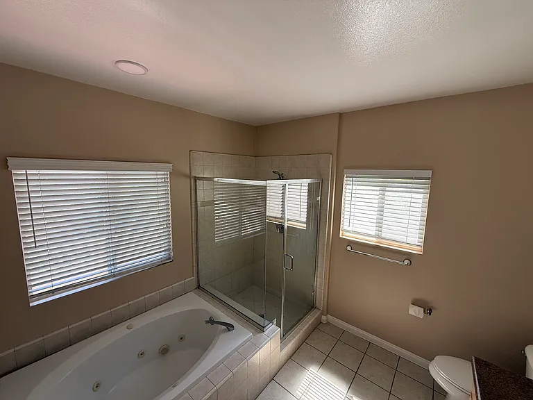 master bathroom with jacuzzi tub, large separate shower
