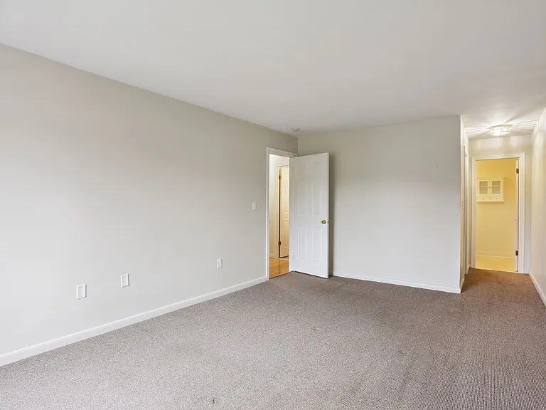 BEDROOM #2 , VIEW OF ENTRY AND PRIVATE 1/2 BATH AREA , AND WALK IN CLOSET AREA