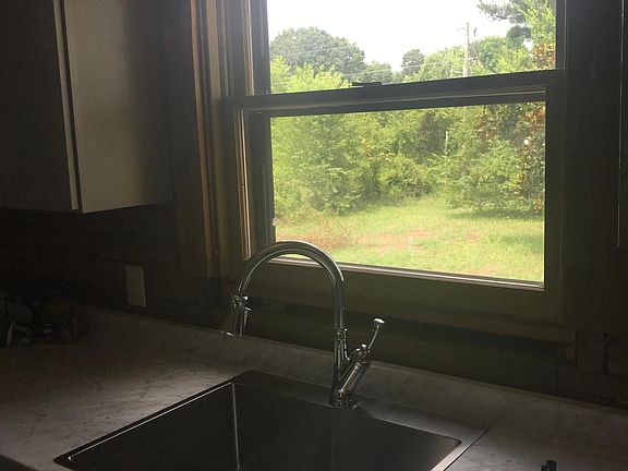 New kitchen cabinets, counter and big farmhouse sink. All appliances included. Excellent condition.