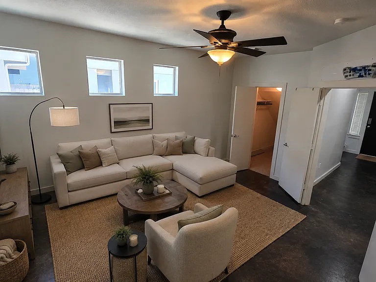Downstair lounge room is shown furnished for illustration purposes. The property is unfurnished.