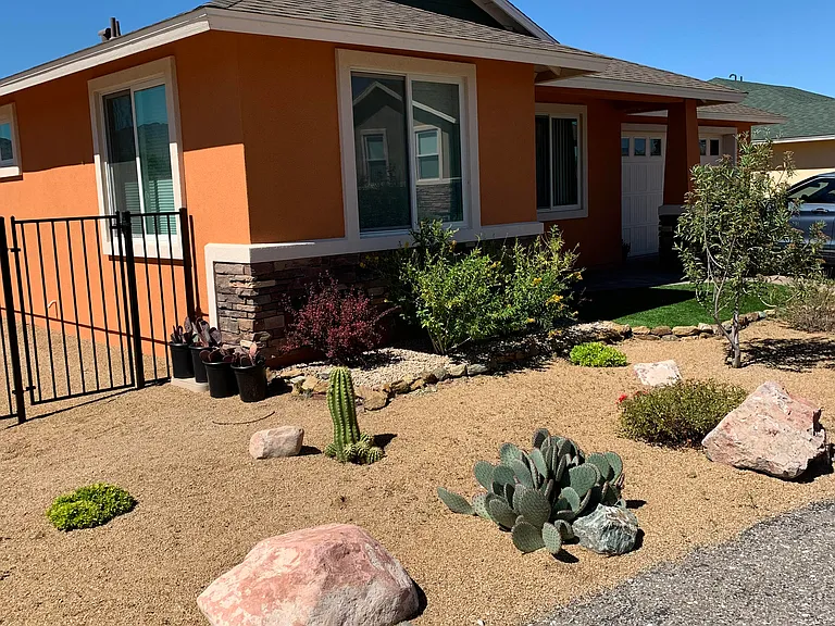 Welcome to 445 Kindra Heights Road. The front yard of the home, which is located on the corner of a cul-de-sac and a dead end road. The street gets little traffic.