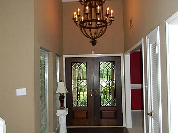 Stunning entering with double leaded glass doors. Entry offers a beautiful light fixture with high v