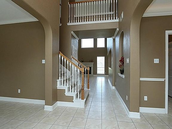 Step inside this 2-story entrance and instantly feel the warmth and elegance of this fine home.