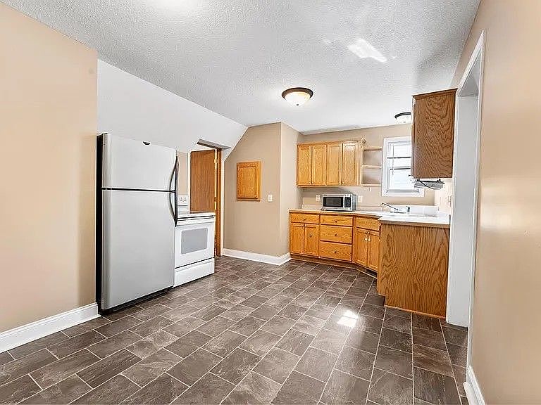 Photo of dining room looking into the kitchen