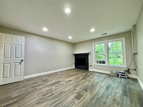 Main bedroom dimensions are 15'x13' with 9 foot ceilings. Working fireplace and daylight windows.
