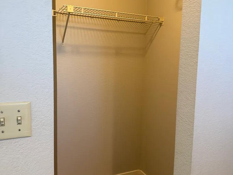 right side of primary walk in closet