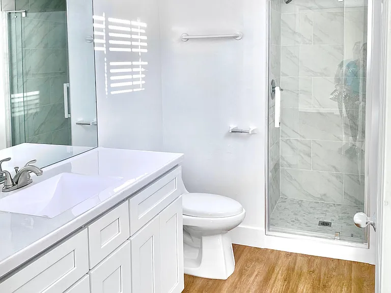 master bath room with marble tile shower
