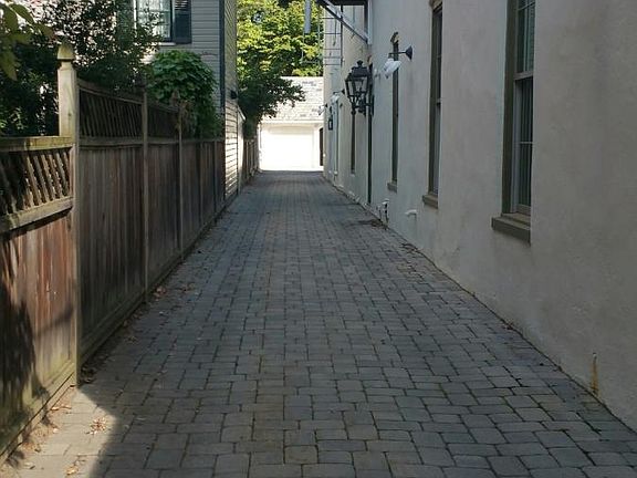 Driveway to Garages and apartment.