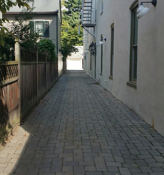 Driveway to Garages and apartment.