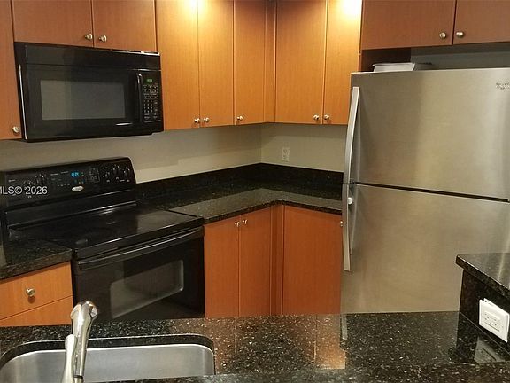 2nd image of 3450 Pinewalk Dr N APT 418