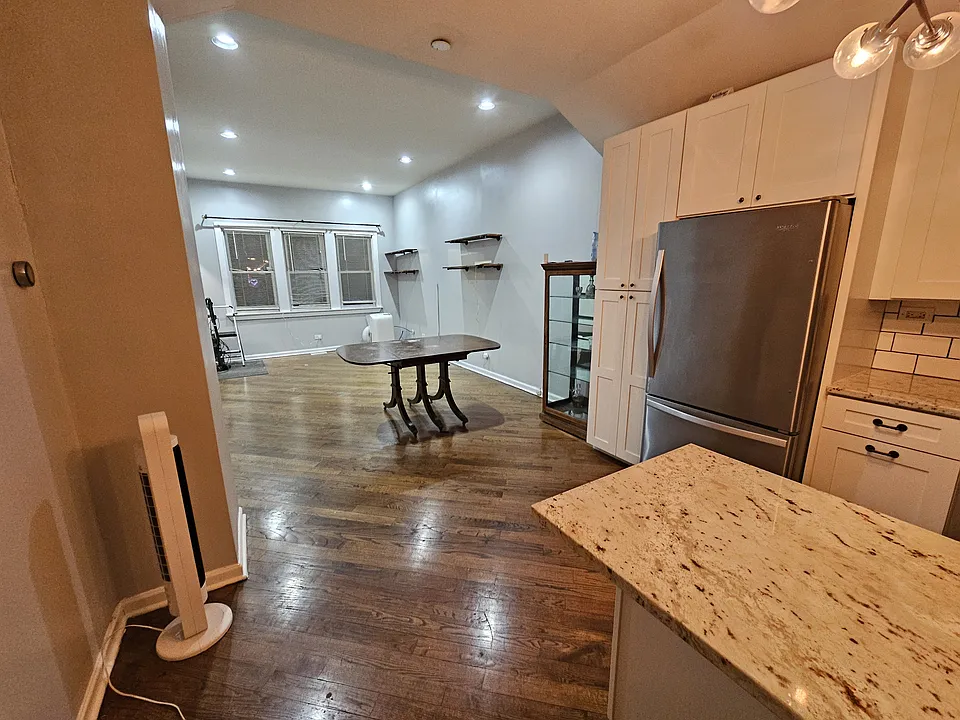 Kitchen leading to dining and living room
