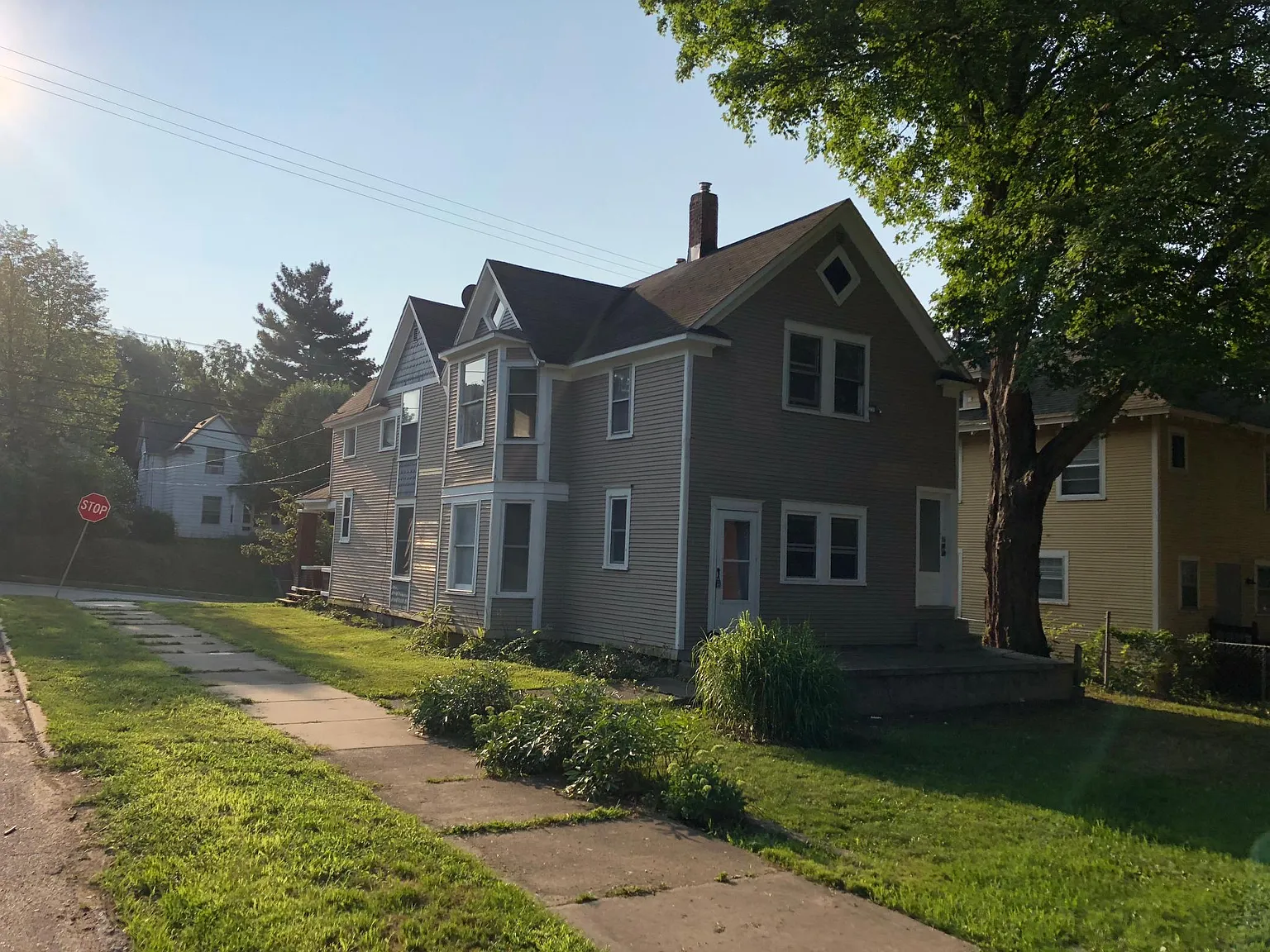 Large corner lot with mature shade trees.