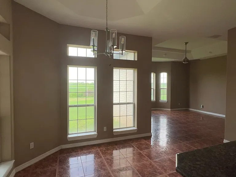 Comfortable dining area right off the kitchen _ ideal for family meals or entertaining guests with easy access to the backyard.
