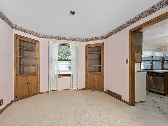 Formal dining rm with built-in corner cabinets