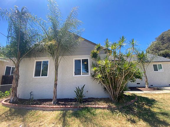 This is the front of the house. The portion to the far right, at the top of the driveway is a separate studio unit (separate private entrance on the side of the studio facing the neighbor, separate yard, etc.) that is occupied by one tenant.