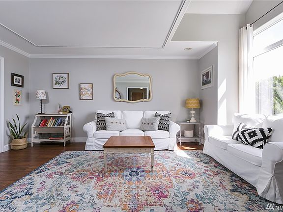 Fresh paint and beautiful hand-scraped oak floors with crown molding accents. 