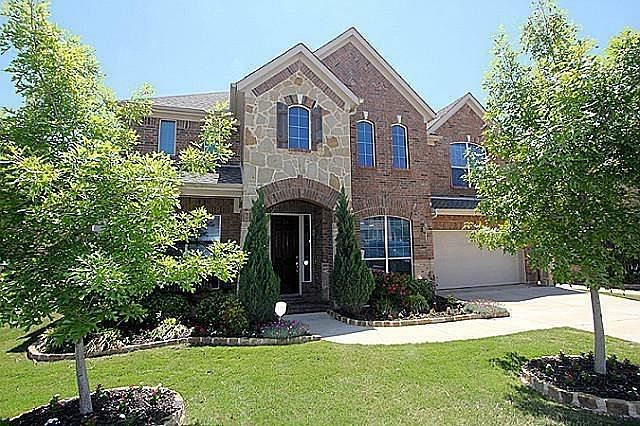 Beautiful exterior with inviting front porch