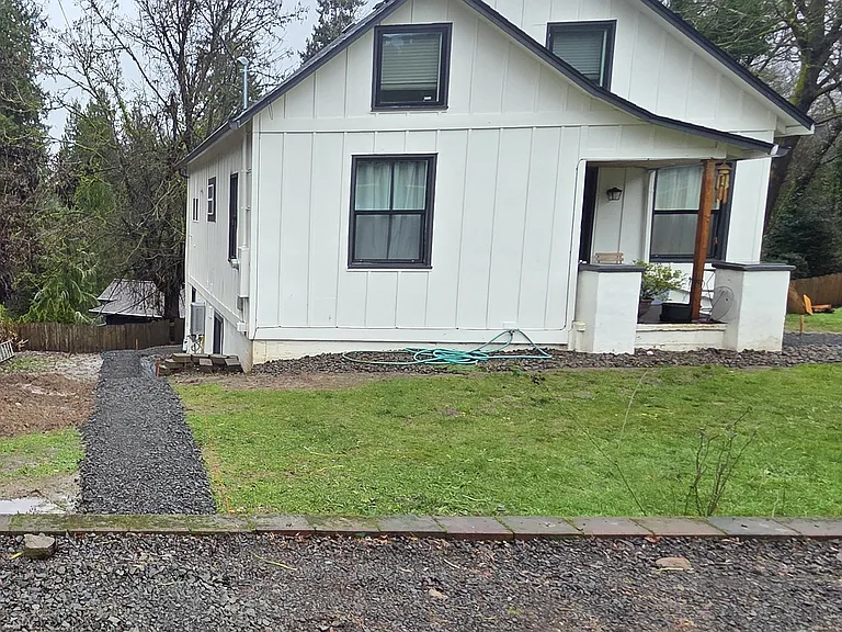 Duplex house. Apartment entrance is private entrance around back of home. Sidewalks under construction as of 15JAN26