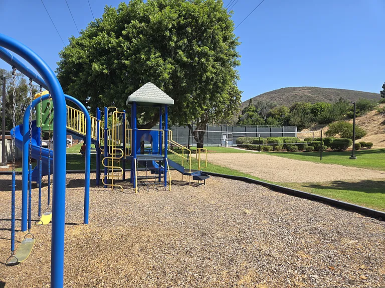 Playground, volleyball court and tennis/pickleball courts