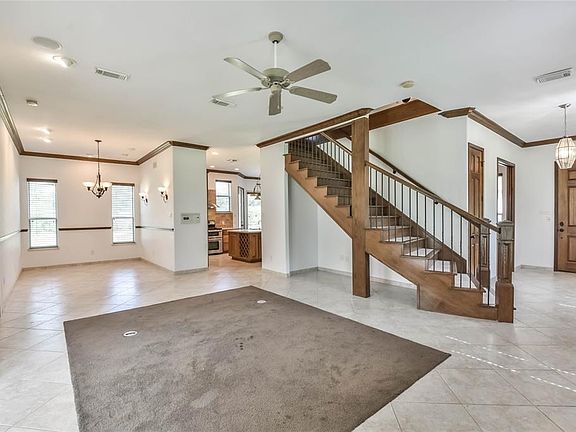 View from the corner of the living room, open to the dining room and kitchen.