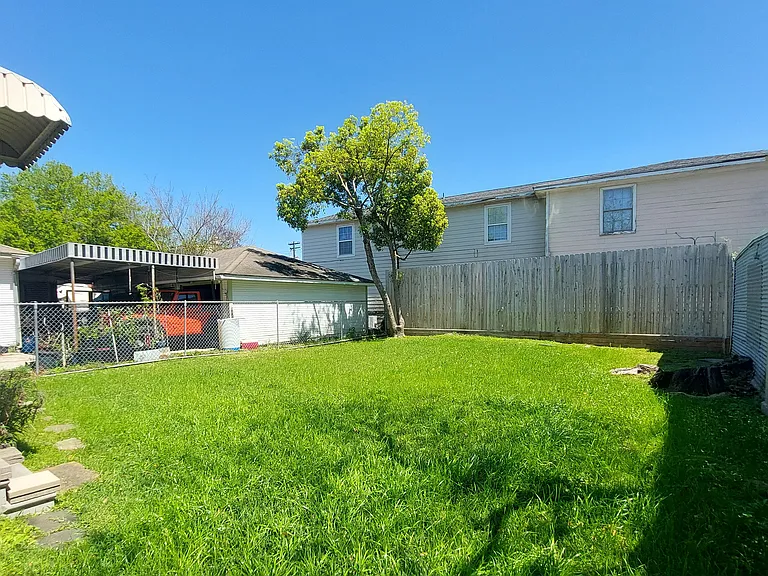 Another view: Look at this large back yard, PUT up a Large Tent and have family gatherings. AND you don't have to cut it! Lawncare is included!