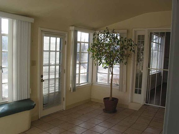 The sun porch provides a warm sunny place year around to sit