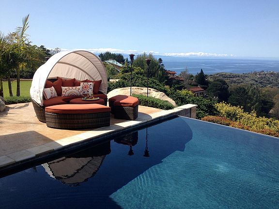infinity pool with amazing ocean and island views