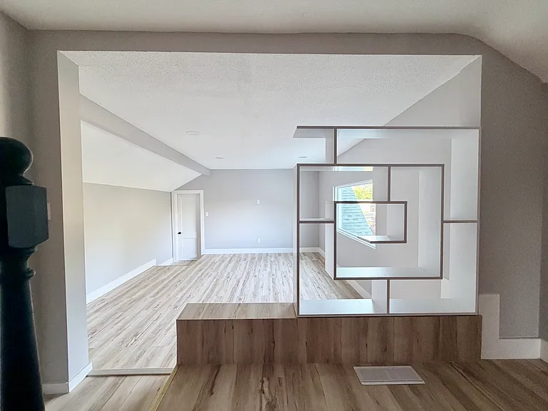 Large second-floor loft with modern built-ins _ perfect for home theater or family room | TV pre-wired