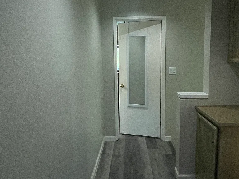 Hallway leading to Master bedroom. Home freshly painted