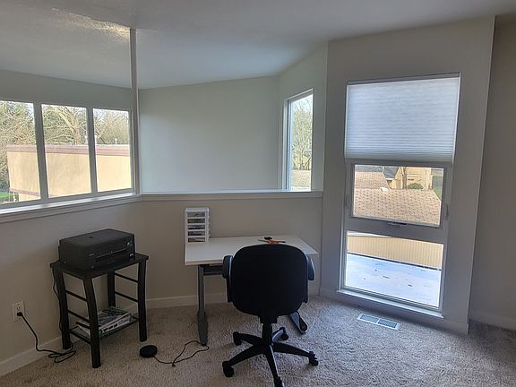 Home office with a view of the park-like landscaping.