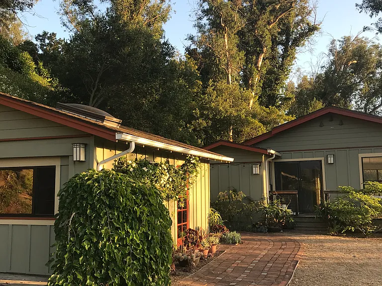 Office at left; rear entrance/ bedroom wing of house straight ahead