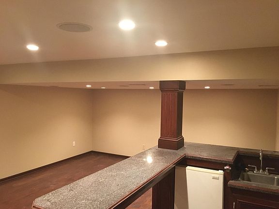 Finished basement with wet bar.