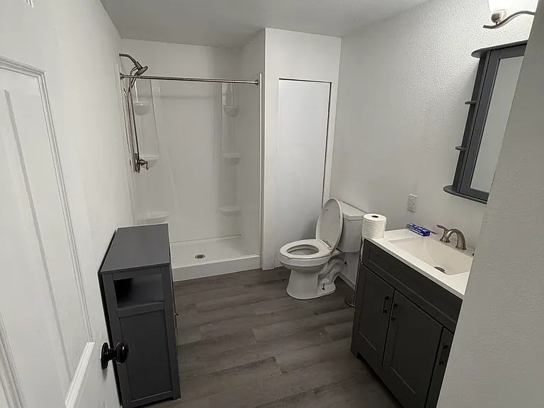 Bathroom off of living area with full shower
